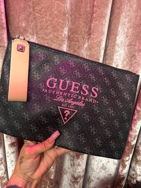 GUESS Black Logo Pouch with Pink Accent and studded clutch handle